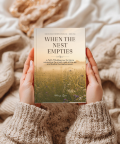 Hands holding on farmstead blanket with coffee When the Nest Empties faith ebook held by hands in cream sweater over cozy farmstead blanket with coffee — empty nest devotional by Missy Lynn